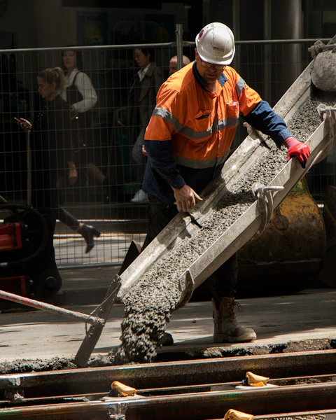 Concreter screeding a slab